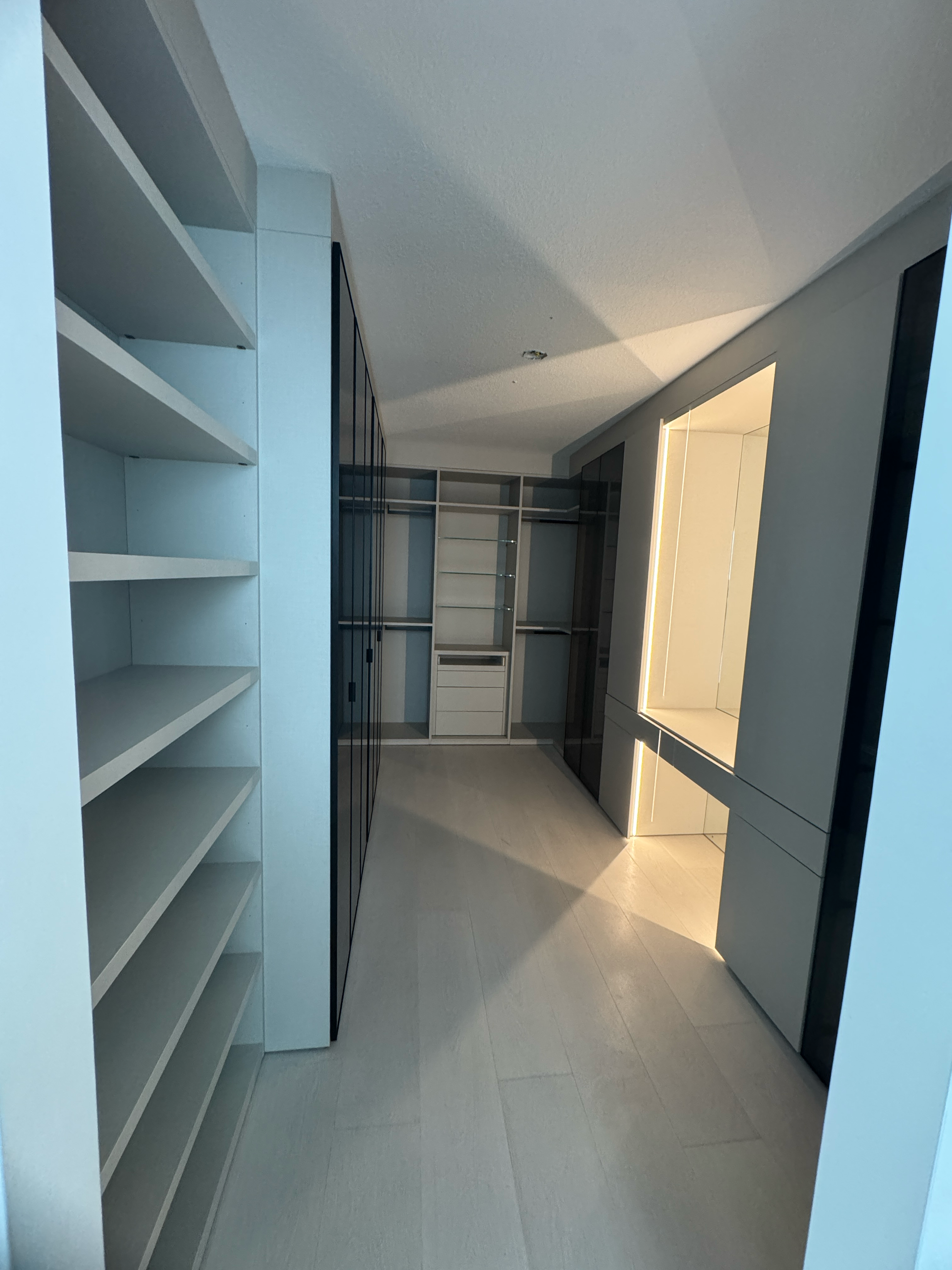 Completed custom closet system with LED lighting